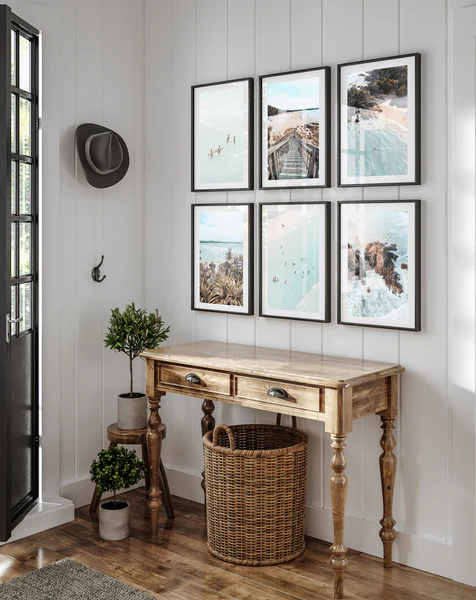 Entryway decorated with a wooden console, woven basket, and artistic canvas wall art – a beautiful and modern interior design idea.