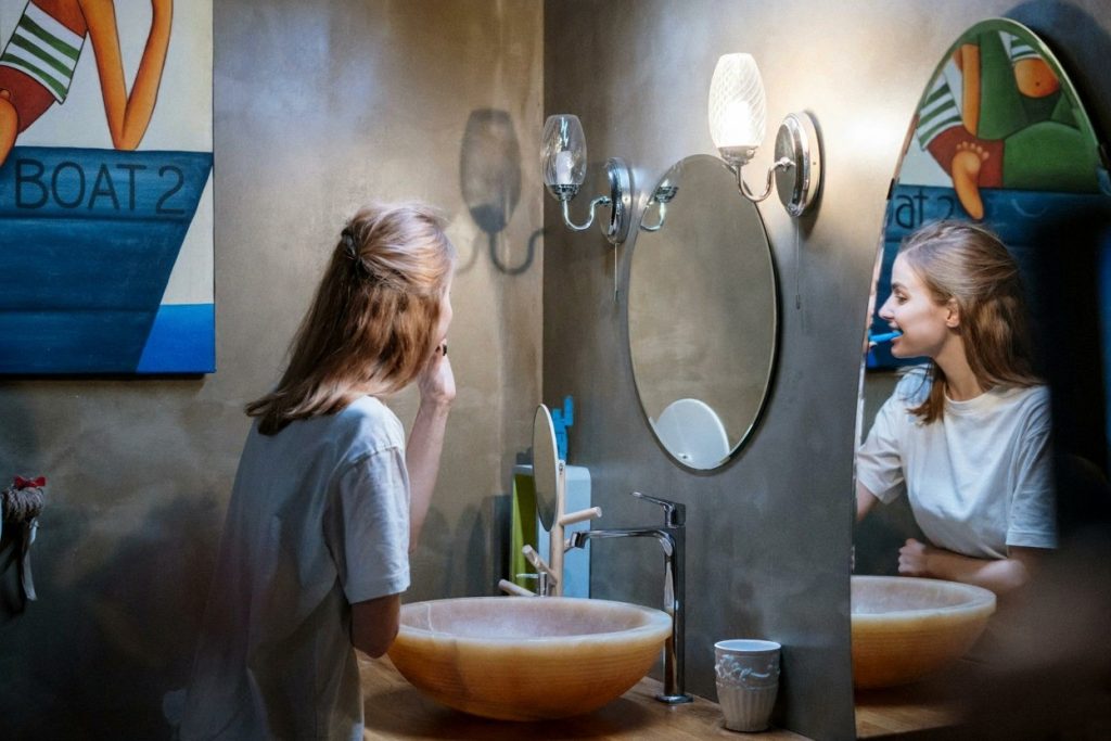 Canvas wall art hanging near a bathroom mirror, adding inspiration and beauty to a daily morning routine.